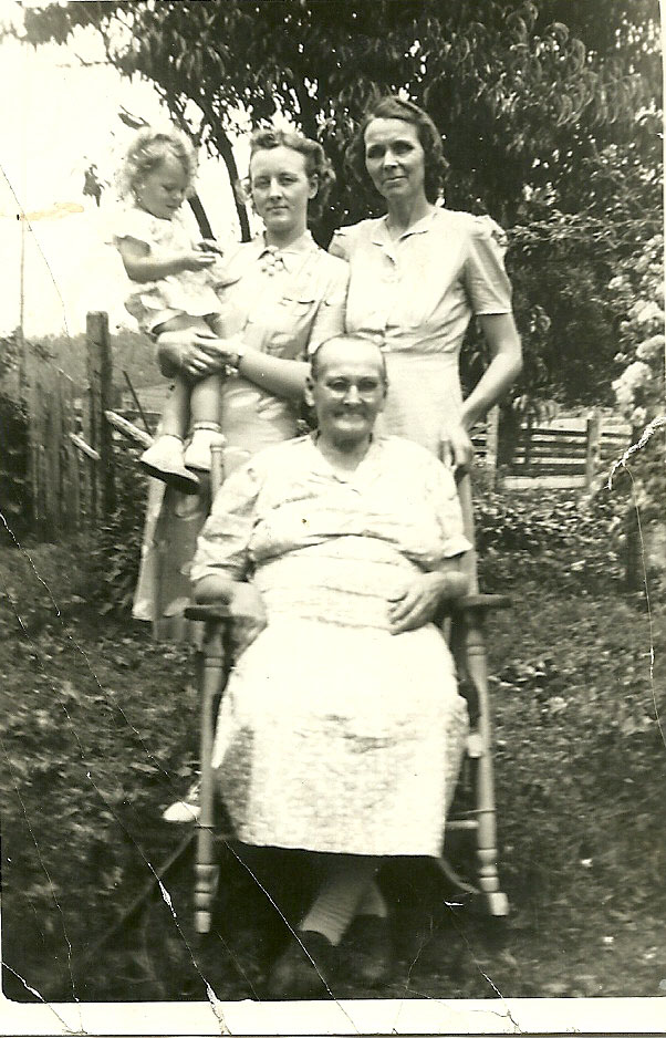 Four Generations - Seated Martha Miller.  Back Row L to R great-granddaughter Joyce Hansard, granddaughter Maxine Lovelace Hansard, daughter Edith Miller Lovelace.