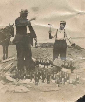  Ed Regenhardt (left) destroying bottles of champaign 